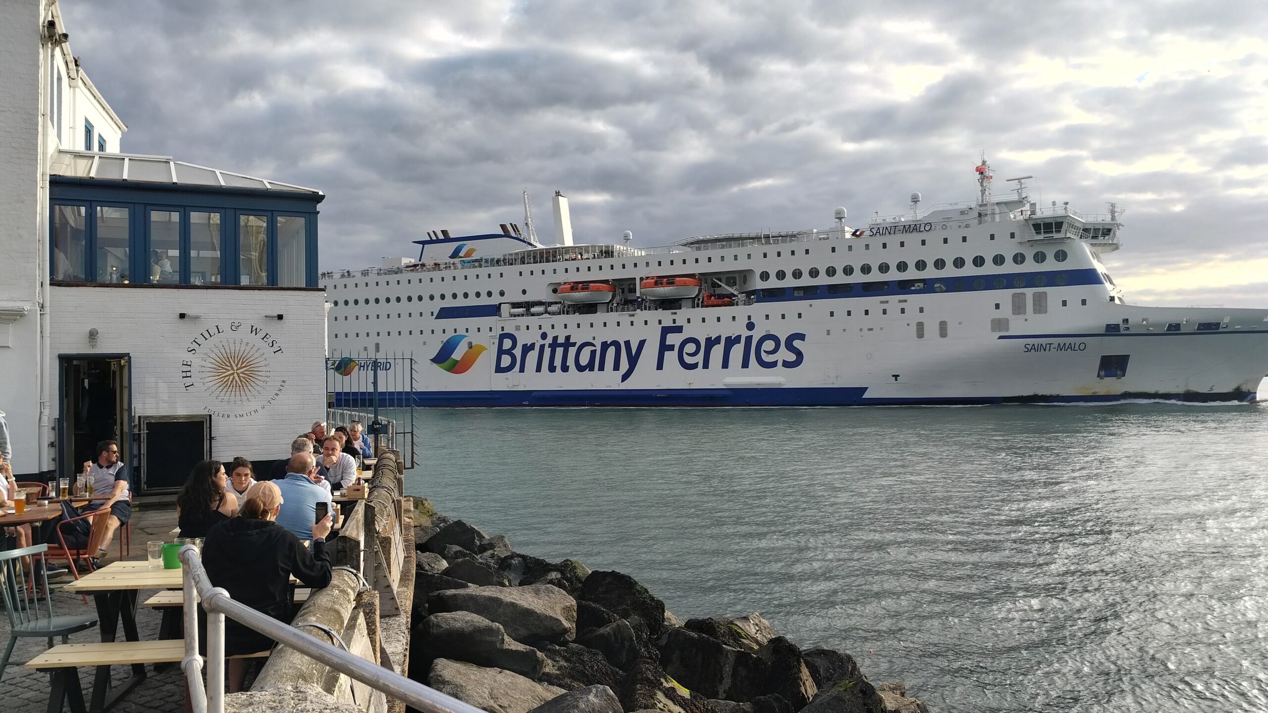Brittany Ferries ship passing the Still and West pub