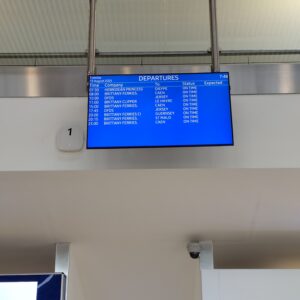 Departures board at Portsmouth ferry terminal listing the day's sailings